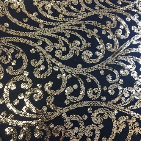 black fabric with gold swirls